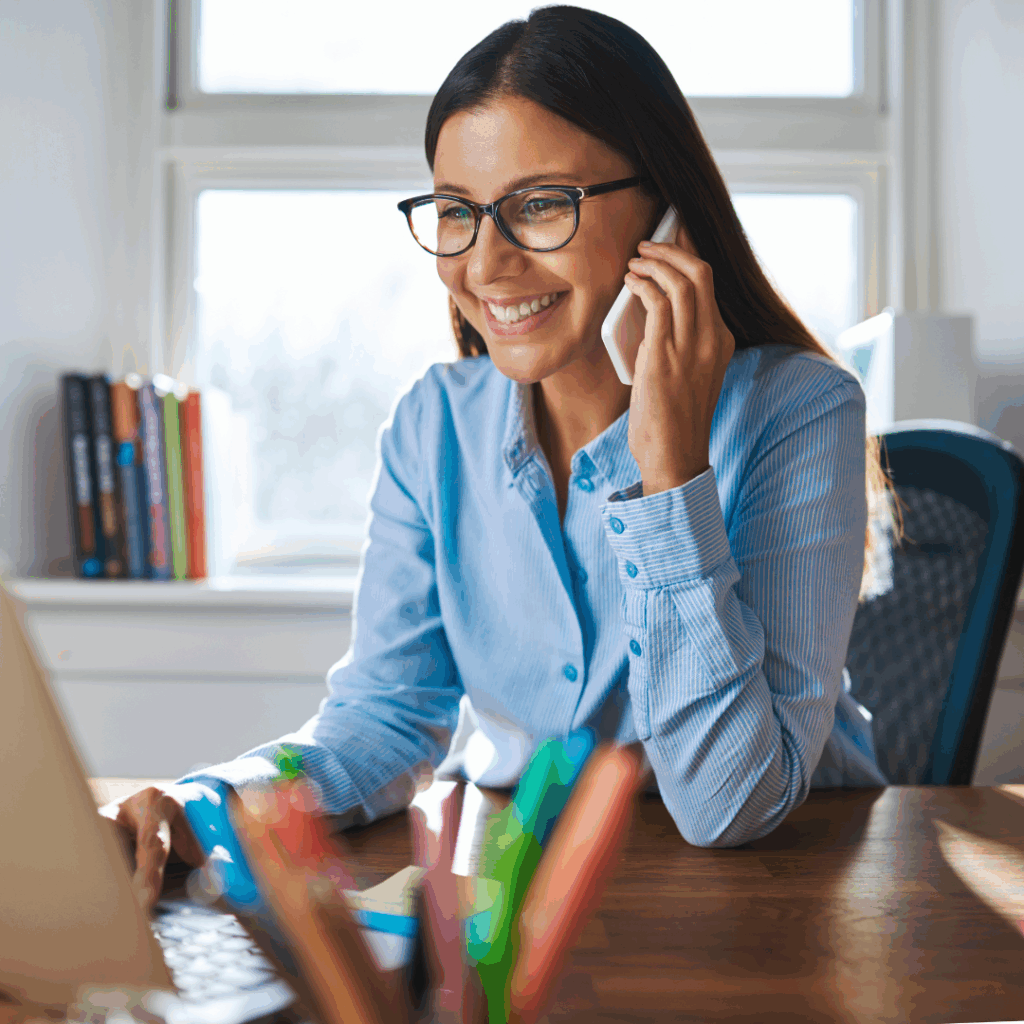 Smiling professional speaking on the phone, representing friendly and approachable recruitment support.